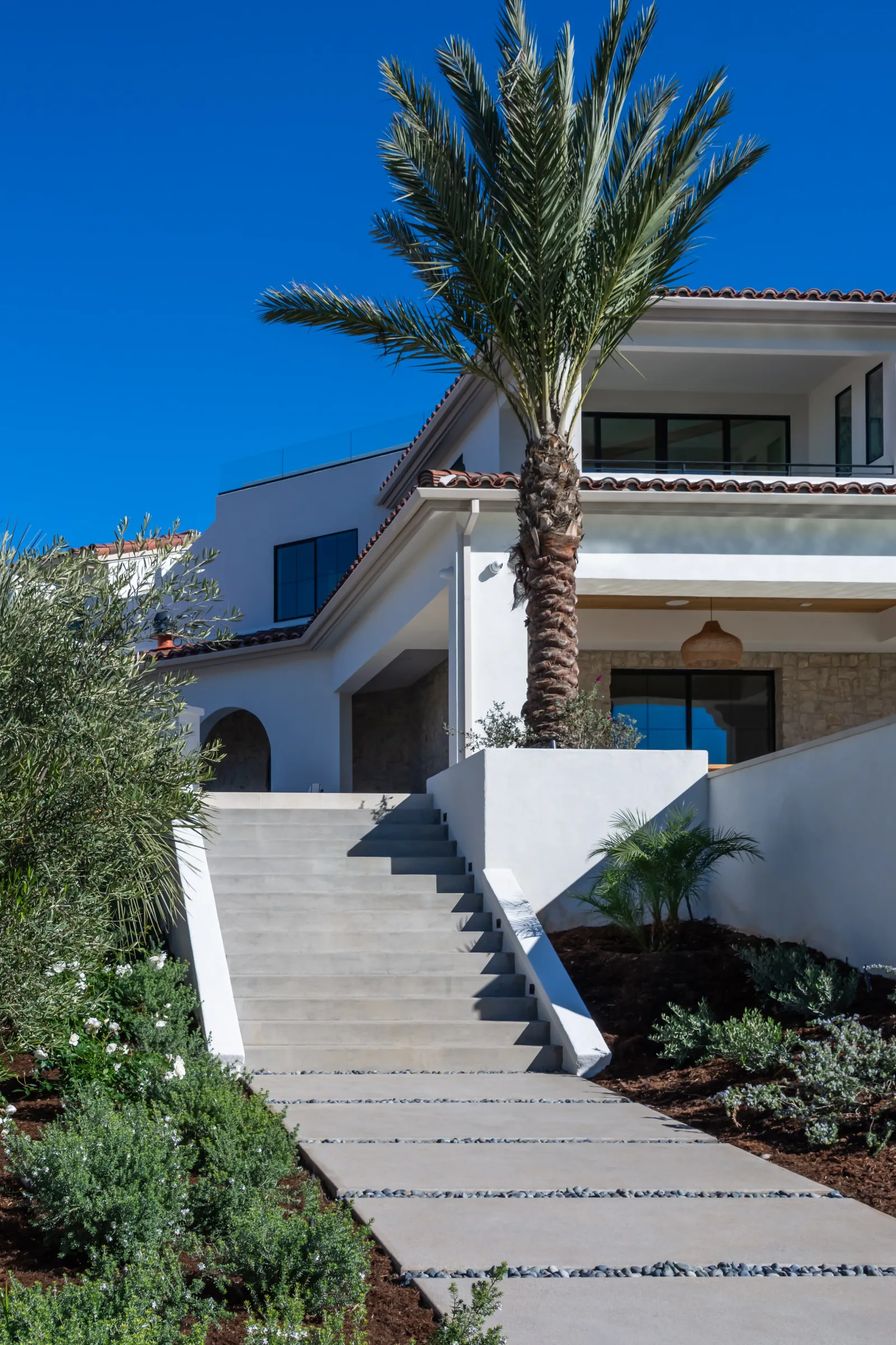 Full backyard remodel in San Diego County with pavers, outdoor kitchen, and patio cover