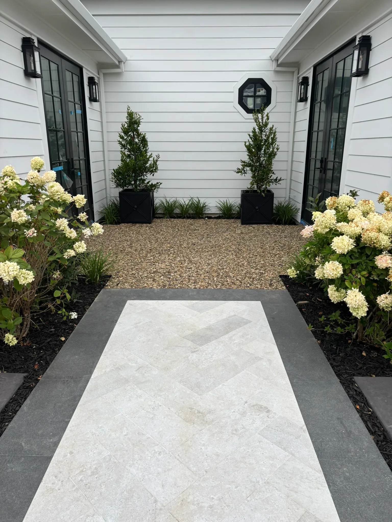 Stone-finish paver patio at a coastal Del Mar home with ocean view
